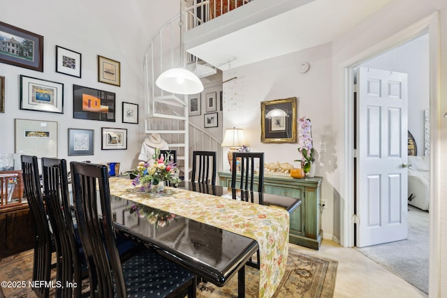 dining space featuring light tile patterned floors