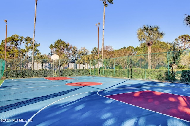 view of sport court with community basketball court and fence