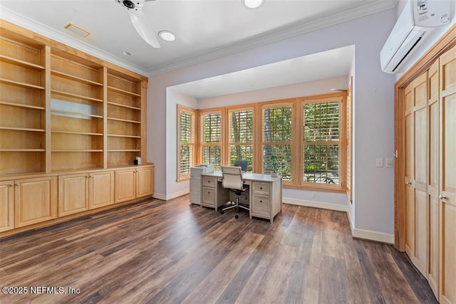 unfurnished office featuring a wall unit AC, baseboards, dark wood-style flooring, and ornamental molding
