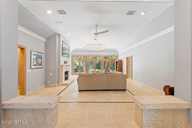 living area featuring recessed lighting, baseboards, and ornamental molding