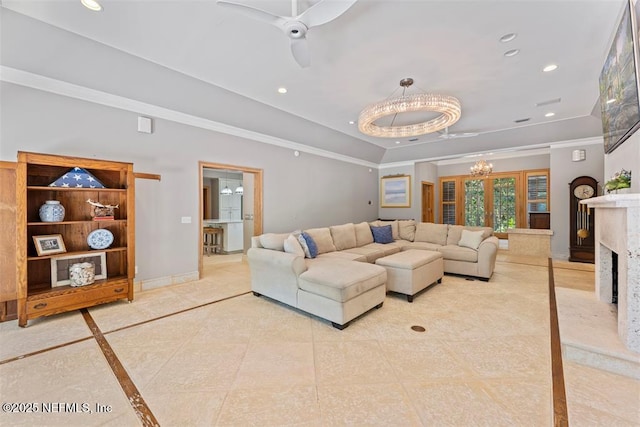 living room featuring recessed lighting, baseboards, ornamental molding, and ceiling fan with notable chandelier