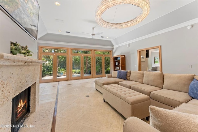 living room with recessed lighting, a fireplace, ceiling fan, vaulted ceiling, and french doors