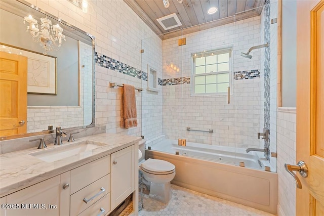 full bath with vanity, visible vents, shower / washtub combination, tile walls, and toilet
