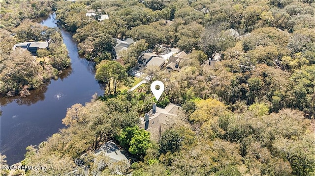 bird's eye view with a wooded view and a water view