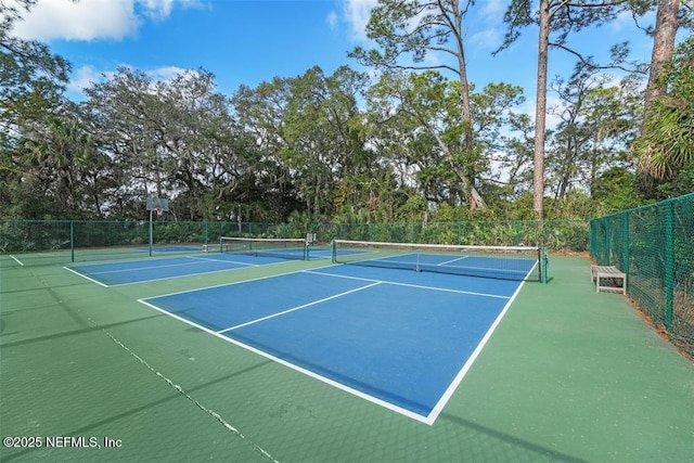 view of sport court featuring community basketball court and fence