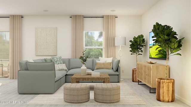 sitting room featuring light wood-style flooring and baseboards