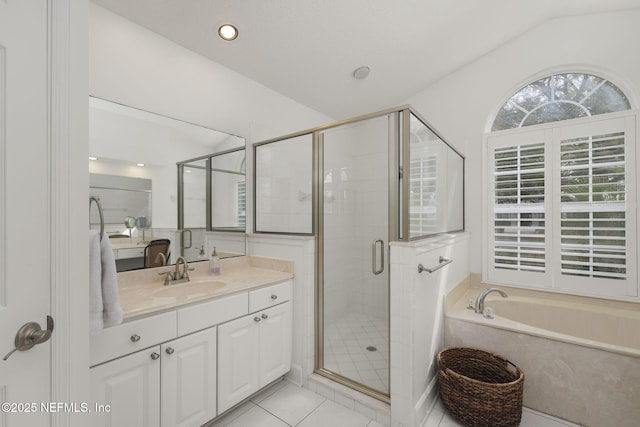 full bath featuring tile patterned floors, a garden tub, vaulted ceiling, vanity, and a shower stall