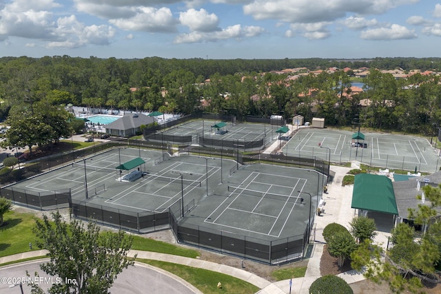 birds eye view of property with a wooded view