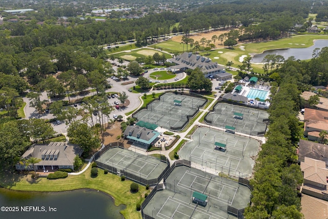 aerial view featuring view of golf course and a water view