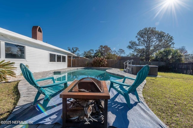 view of pool featuring a yard, a fenced backyard, a fenced in pool, and a hot tub