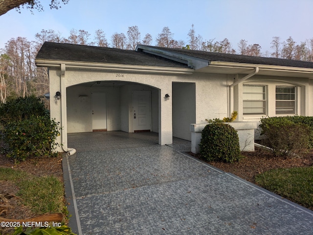 view of front of house featuring stucco siding