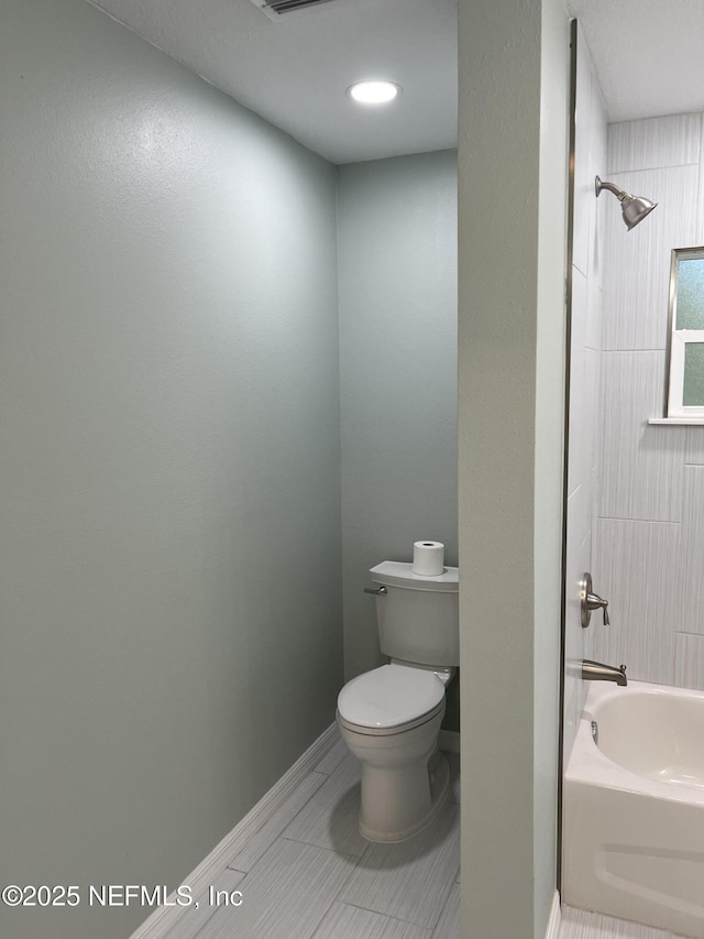 716 Grand Rondo W, Crescent City, FL 32112 - full bath with toilet, shower / bath combination, and baseboards