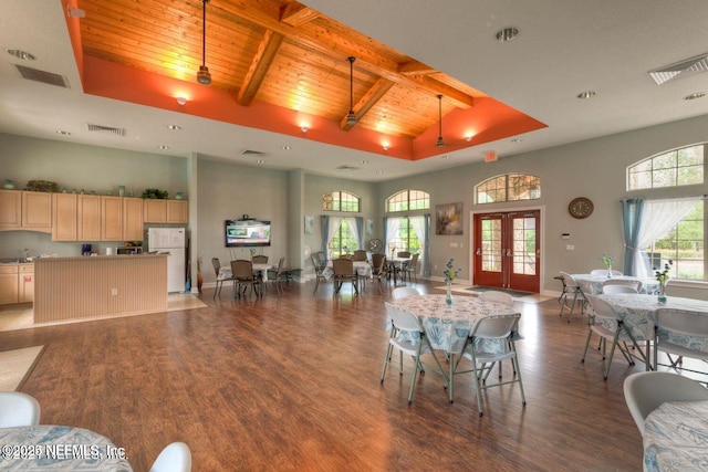 dining room with high vaulted ceiling, french doors, wooden ceiling, and visible vents