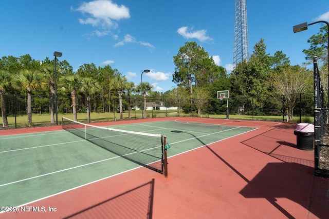 view of sport court with community basketball court and fence