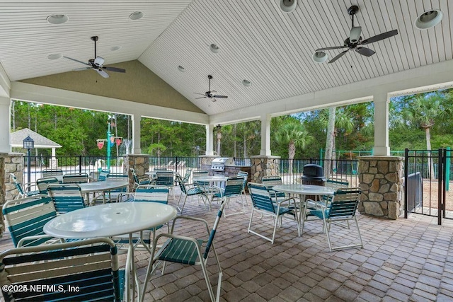 view of patio / terrace featuring fence, outdoor dining area, and a ceiling fan