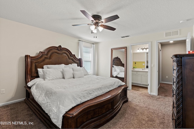 bedroom with baseboards, a textured ceiling, visible vents, and carpet flooring