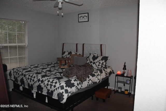 bedroom with a textured ceiling and ceiling fan