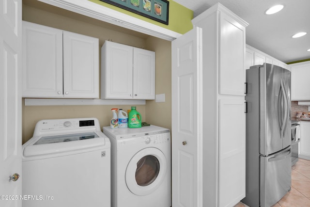 laundry room featuring washer and dryer, laundry area, recessed lighting, and light tile patterned floors