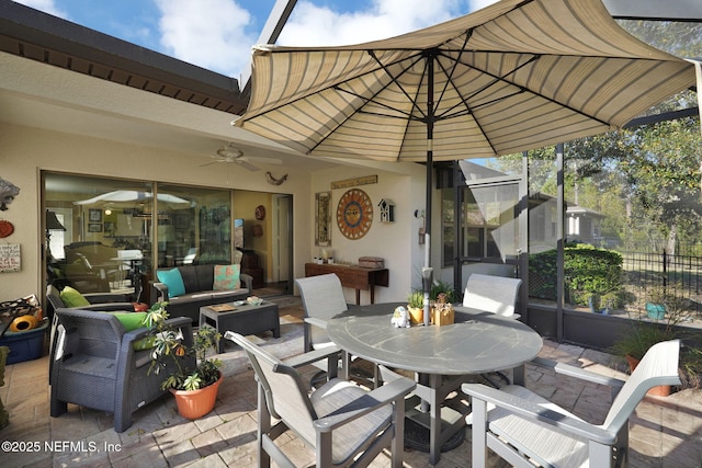 view of patio with fence, outdoor lounge area, and outdoor dining space