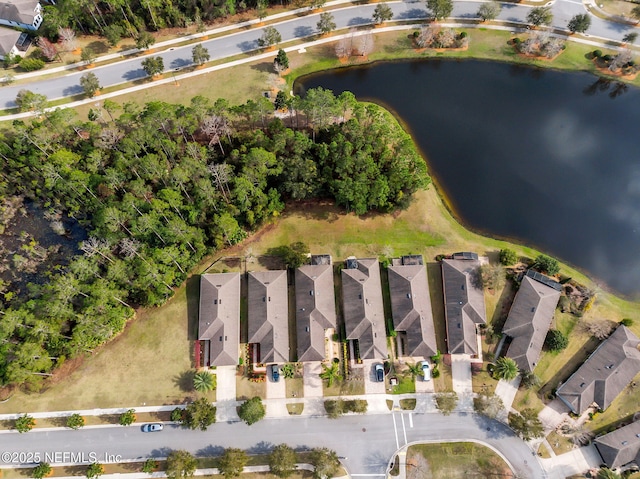 birds eye view of property featuring a water view and a residential view