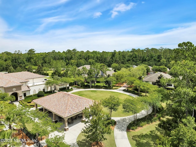 drone / aerial view featuring a view of trees