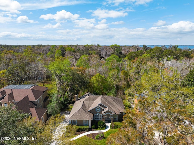 aerial view featuring a forest view