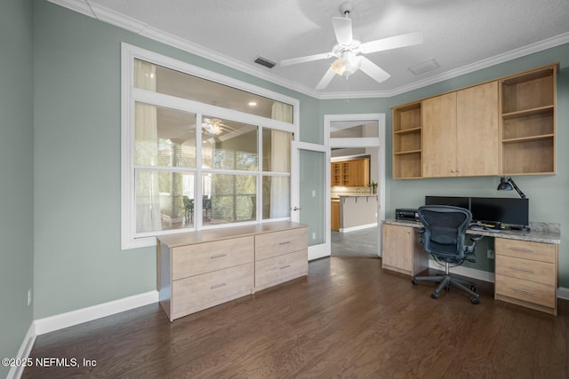 office featuring ornamental molding, dark wood finished floors, visible vents, and a ceiling fan