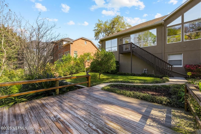 exterior space featuring stairs and a lawn