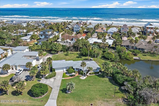 birds eye view of property featuring a water view and a residential view