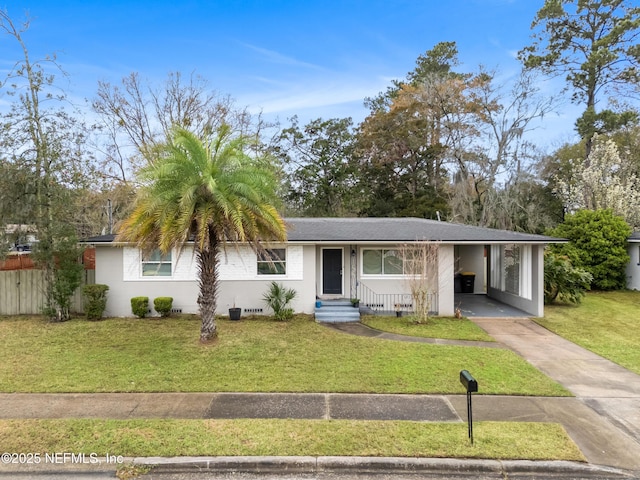 ranch-style home with driveway, crawl space, a front lawn, and an attached carport