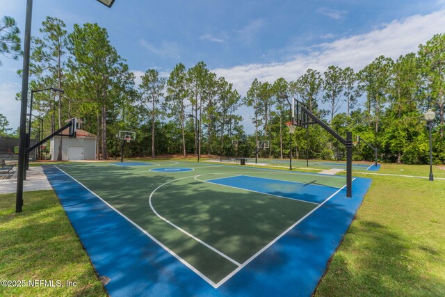 view of sport court featuring community basketball court and a lawn