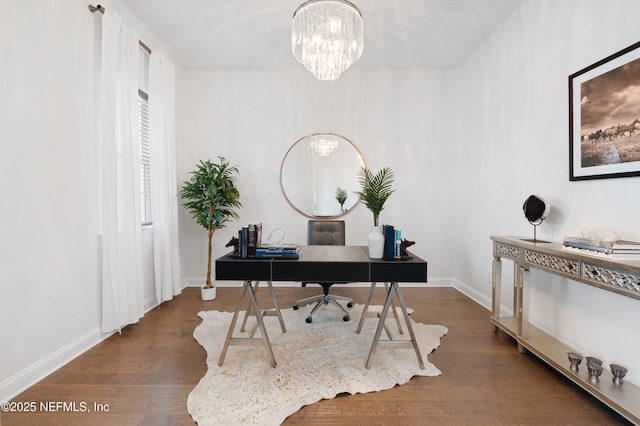 office featuring a notable chandelier, baseboards, and wood finished floors