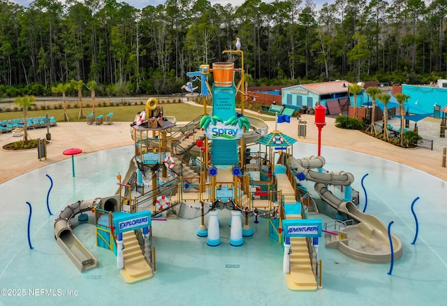 community play area featuring a view of trees