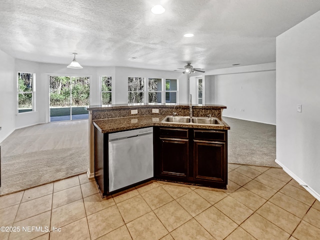 kitchen featuring light colored carpet, a sink, open floor plan, dishwasher, and decorative light fixtures