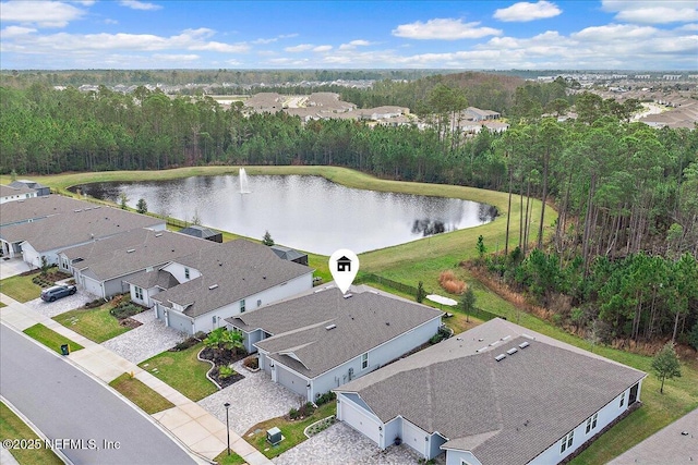 drone / aerial view with a water view and a residential view