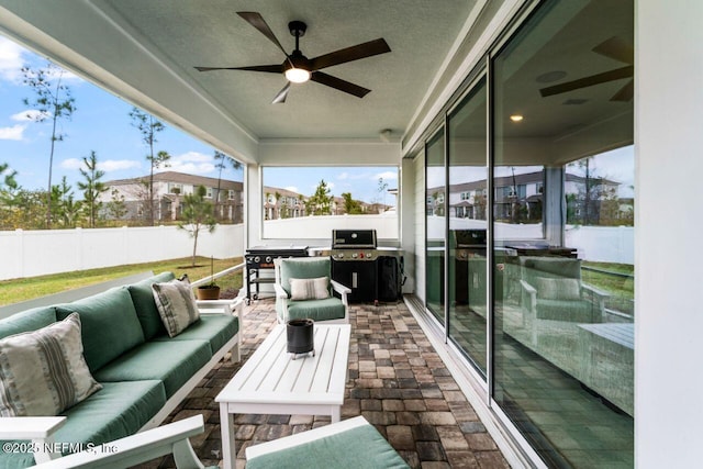 view of patio / terrace with a fenced backyard, ceiling fan, an outdoor living space, and area for grilling