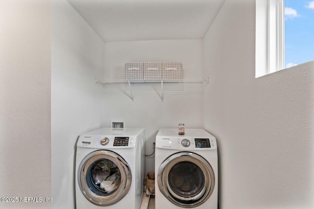 washroom featuring laundry area and washer and dryer