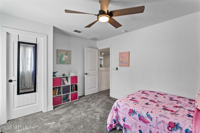 bedroom with carpet, visible vents, a ceiling fan, a textured ceiling, and baseboards