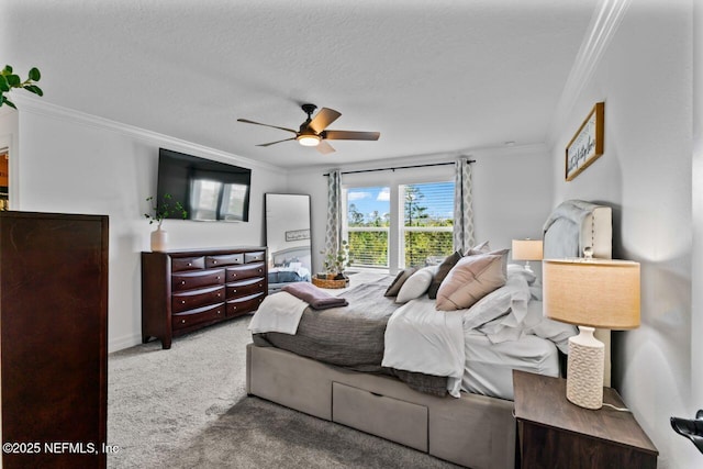 bedroom featuring ceiling fan, a textured ceiling, crown molding, and carpet flooring