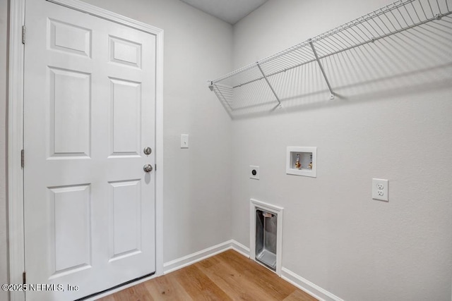 laundry room featuring hookup for an electric dryer, laundry area, washer hookup, wood finished floors, and baseboards