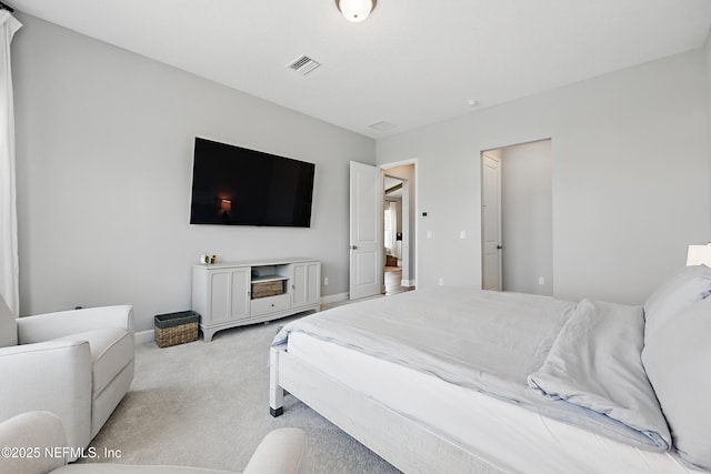 bedroom featuring light carpet, baseboards, and visible vents