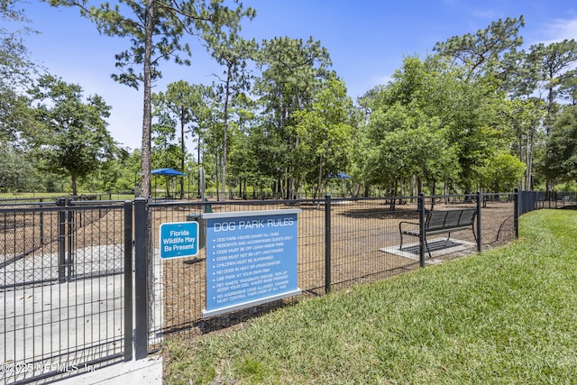 view of home's community featuring fence