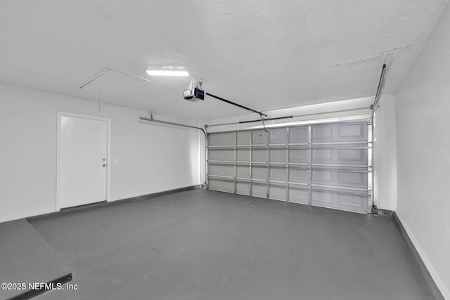 garage with a garage door opener and baseboards