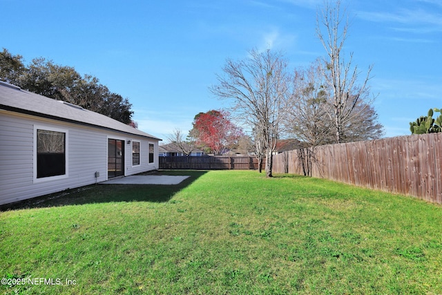 view of yard with a fenced backyard and a patio