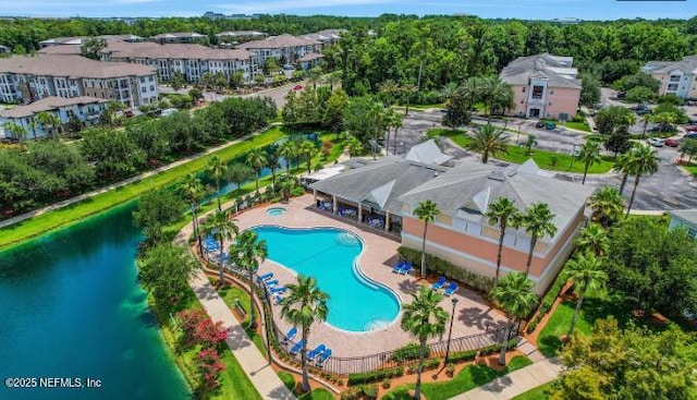 bird's eye view with a water view and a residential view