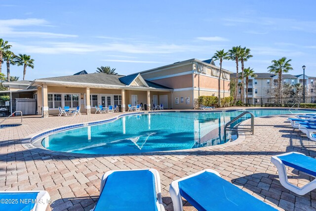 4920 Key Lime Dr Unit 305, Jacksonville, FL 32256 - community pool featuring a patio area