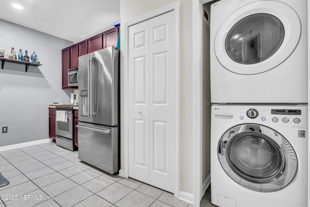 4920 Key Lime Dr Unit 305, Jacksonville, FL 32256 - washroom with stacked washer / drying machine, light tile patterned flooring, and recessed lighting