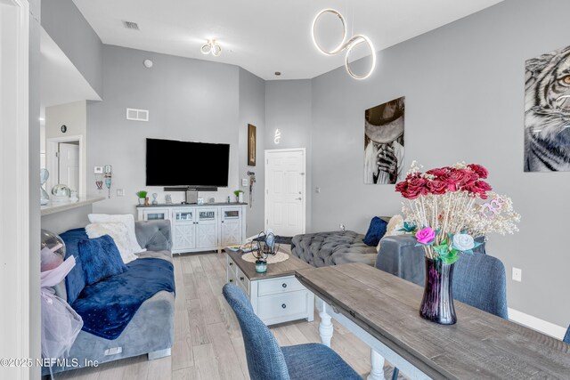 4920 Key Lime Dr Unit 305, Jacksonville, FL 32256 - living room with light wood-style flooring and a high ceiling