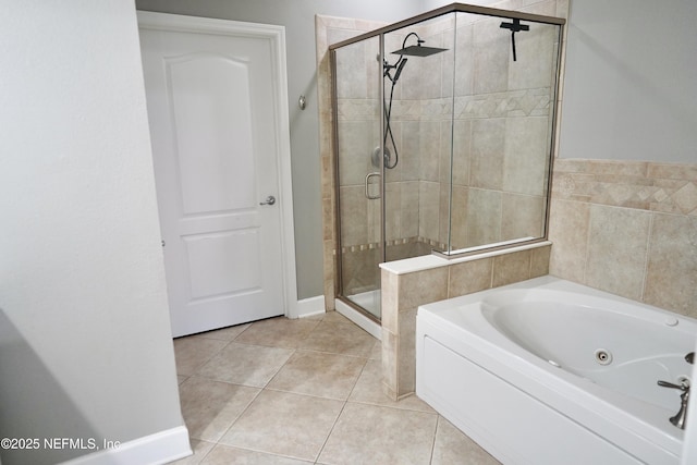 full bath featuring a whirlpool tub, a stall shower, and tile patterned flooring