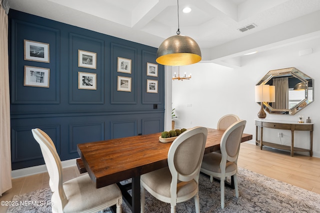 230 Marquesa Cir, Saint Johns, FL 32259 - dining room featuring visible vents, coffered ceiling, light wood-style flooring, beamed ceiling, and a decorative wall